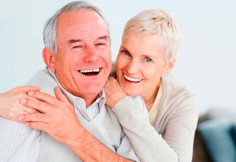 senior couple embraced inside home