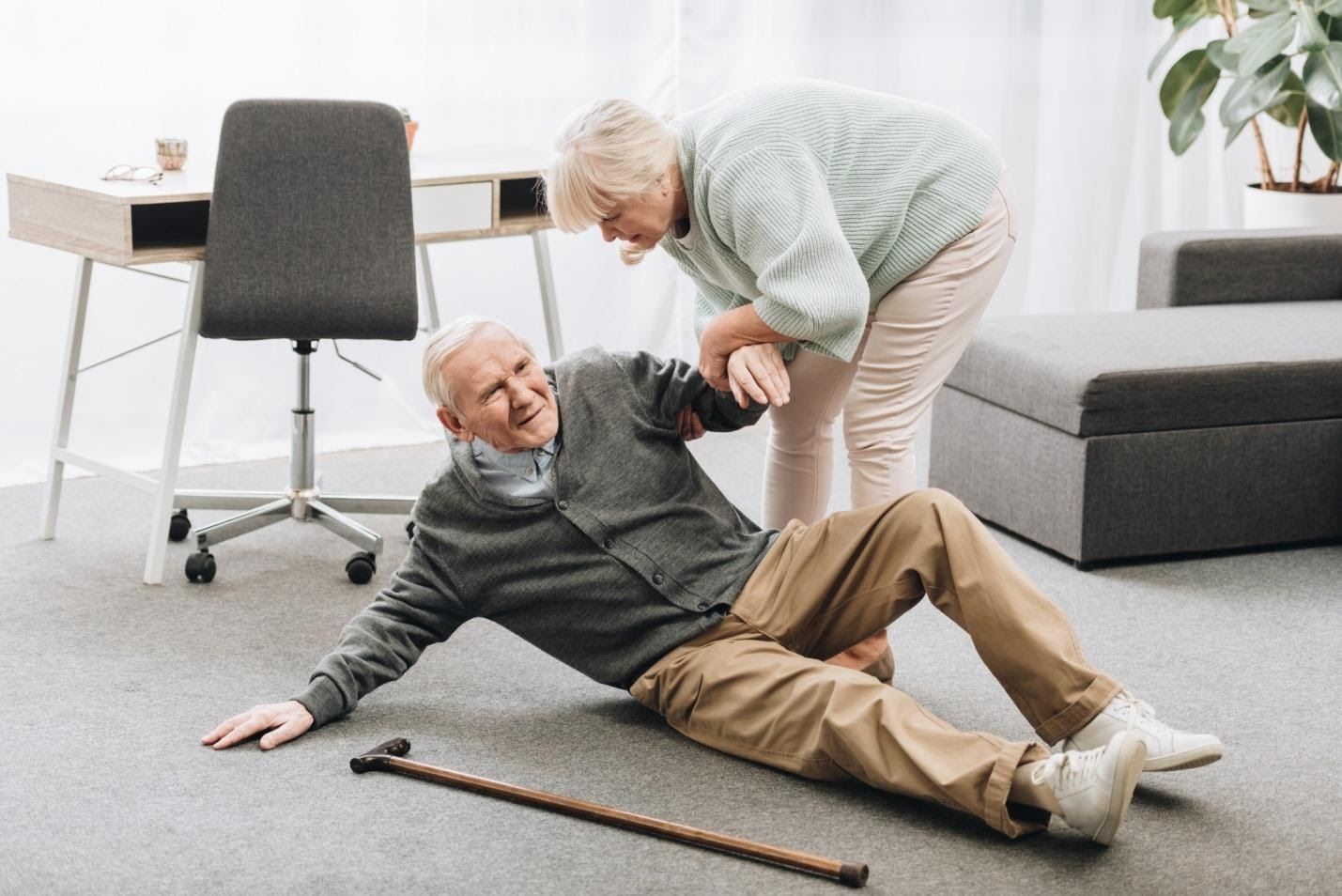 Senior couple man fell on ground